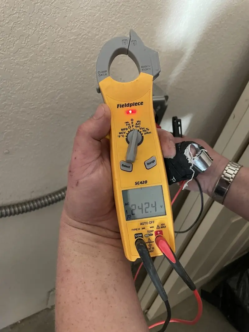 Voltage testing with clamp meter during Aluminum Wiring Replacement in Pleasant Garden